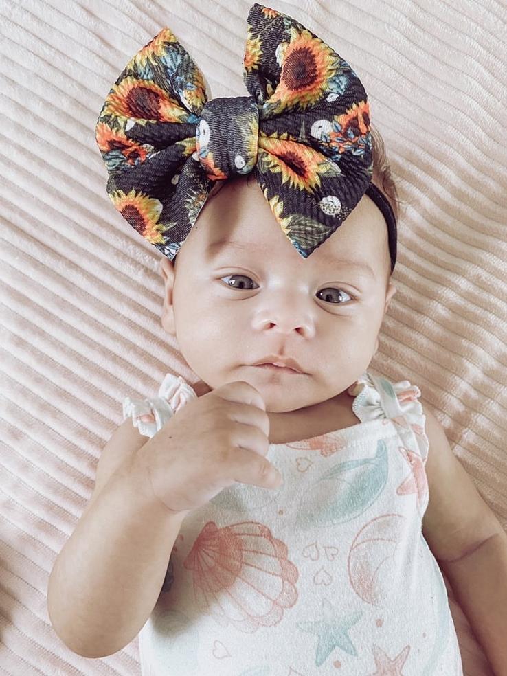 Baby girl with floral bow